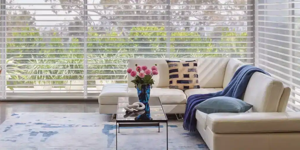 Bright, contemporary decor with natural sunlight, stylish accents, and fresh plantings create inviting and relaxing home atmosphere.